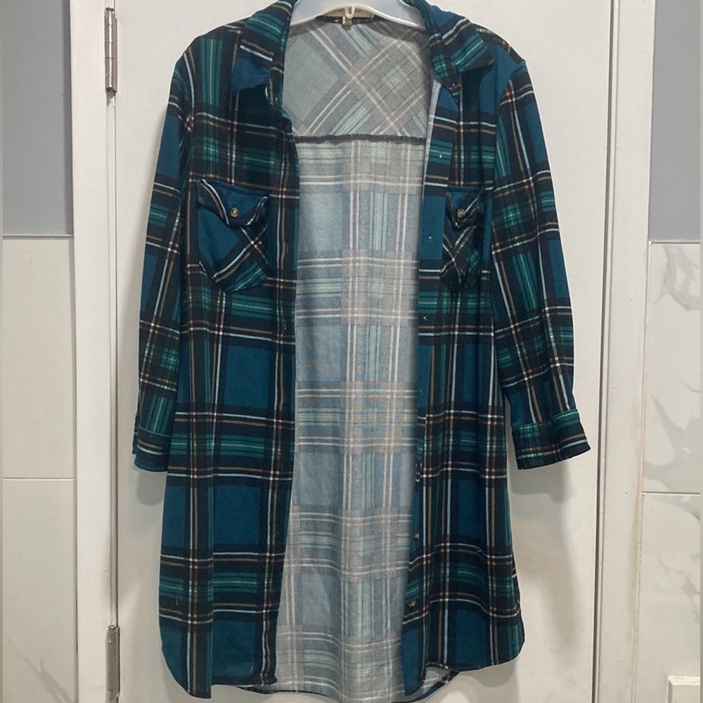 Long, green plaid shirt.